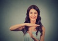 Young, happy, smiling woman showing time out gesture with hands Royalty Free Stock Photo