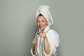 Young happy spa woman taking a shower and singing on white background Royalty Free Stock Photo