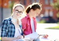 Young happy students with books and notes outdoors Royalty Free Stock Photo