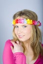 Young happy summer woman with funny flower band