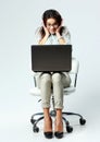 Young happy surprised businesswoman with laptop sitting on chair Royalty Free Stock Photo