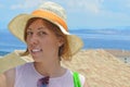 Young happy tanned girl portrait with sea in background Royalty Free Stock Photo