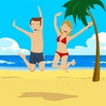 Young happy teenage couple jumping on tropical beach with palm trees Royalty Free Stock Photo