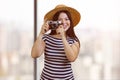 Young happy tourist asian woman in straw hat with vintage photo camera. Royalty Free Stock Photo