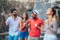 Young happy tourists sightseeing in city. Royalty Free Stock Photo