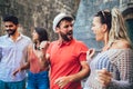 Young happy tourists sightseeing in city. Royalty Free Stock Photo