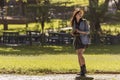 Young happy traveler exploring surrounds with film camera