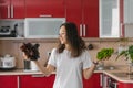 Young happy vegetarian nutritionist woman holds two types of salad in her hands, natural organic food, healthy food at home