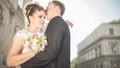 Young happy wedding couple bride meets groom on a wedding day. Happy newlyweds on terrace with gorgeous view. Royalty Free Stock Photo