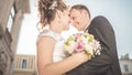 Young happy wedding couple bride meets groom on a wedding day. Happy newlyweds on terrace with gorgeous view. Royalty Free Stock Photo