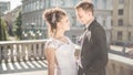 Young happy wedding couple bride meets groom on a wedding day. Happy newlyweds on terrace with gorgeous view. Royalty Free Stock Photo