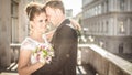 Young happy wedding couple bride meets groom on a wedding day. Happy newlyweds on terrace with gorgeous view. Royalty Free Stock Photo