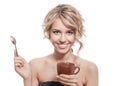 Young happy woman with an aromatic coffee in hands. Isolated