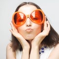 Young happy woman with big orange sunglasses Royalty Free Stock Photo