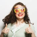 Young happy woman with big orange sunglasses Royalty Free Stock Photo