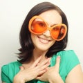 Young happy woman with big orange sunglasses Royalty Free Stock Photo