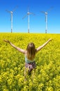 Young happy woman on blooming rapeseed field Royalty Free Stock Photo