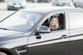 Young happy woman bought new modern car Royalty Free Stock Photo