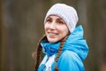 Young happy woman with braids on winter activity