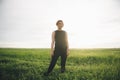 Portrait of beautiful asian woman smiling and looking away at grass field. Royalty Free Stock Photo