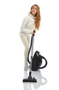 Young happy woman cleaning home floor with vacuum cleaner Royalty Free Stock Photo