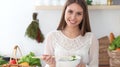 Young happy woman cooking in the kitchen. Healthy meal, lifestyle and culinary concepts. Good morning begins with fresh Royalty Free Stock Photo