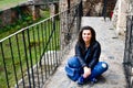 Young happy woman at Corvin Castle, Romania Royalty Free Stock Photo