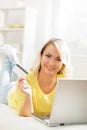 Young and happy woman with a credit card. Online shopping concept Royalty Free Stock Photo
