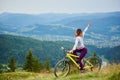 Young happy woman cycling on mountain bike at summer day Royalty Free Stock Photo