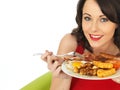 Young Happy Woman Eating a Full English Breakfast Royalty Free Stock Photo
