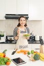 Young happy woman eating salad. Healthy lifestyle with green food. Royalty Free Stock Photo