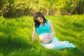 Young happy woman in expectation of baby Royalty Free Stock Photo