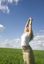 Young happy woman in field Royalty Free Stock Photo