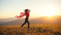 Happy woman with flag of united states enjoying the sunset on na Royalty Free Stock Photo