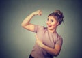 Young happy woman flexing muscles showing her strength. Weight loss concept Royalty Free Stock Photo
