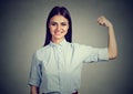 Young happy woman flexing muscles showing strength Royalty Free Stock Photo