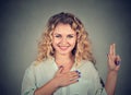 Young happy woman in glasses making a promise Royalty Free Stock Photo