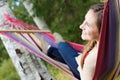 Young happy woman in hammock