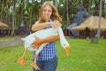 Young happy woman hold in hands funny pet - white goose Royalty Free Stock Photo