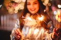 Young happy woman holding sparklers