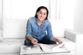 Young happy woman at home couch accounting bank and business papers