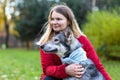 Young happy woman hugging dog. pet adoption. Royalty Free Stock Photo