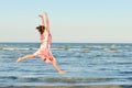 Young happy woman jumping high at seaside Royalty Free Stock Photo