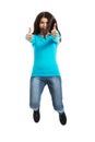 Young happy woman jumping with thumbs up Royalty Free Stock Photo