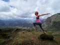 Young happy woman jumping on top of the mountain Royalty Free Stock Photo