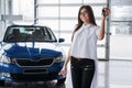 Young happy woman near the car with keys in hand Royalty Free Stock Photo