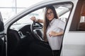 Young happy woman near the car with keys in hand Royalty Free Stock Photo