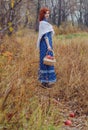 Young happy woman in a park near the river in autumn season Royalty Free Stock Photo