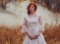 Young happy woman in a park near the river in autumn season Royalty Free Stock Photo