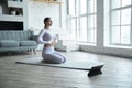 Professional yoga practitioner lady in grey sports suit Royalty Free Stock Photo